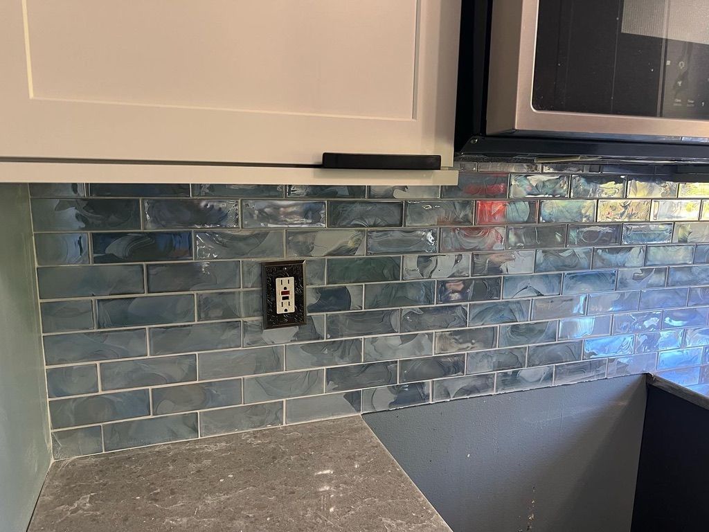 Kitchen backsplash — iridescent glass tile