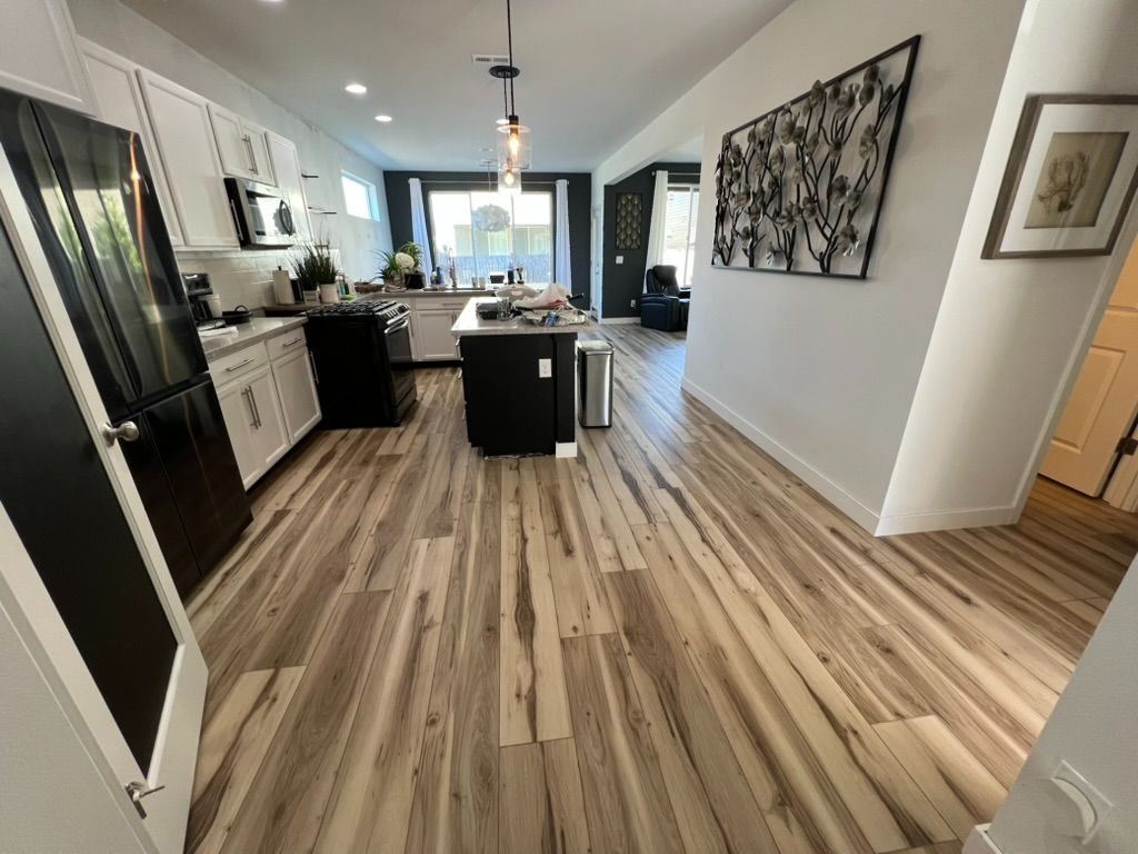 Open-concept kitchen with hardwood floors