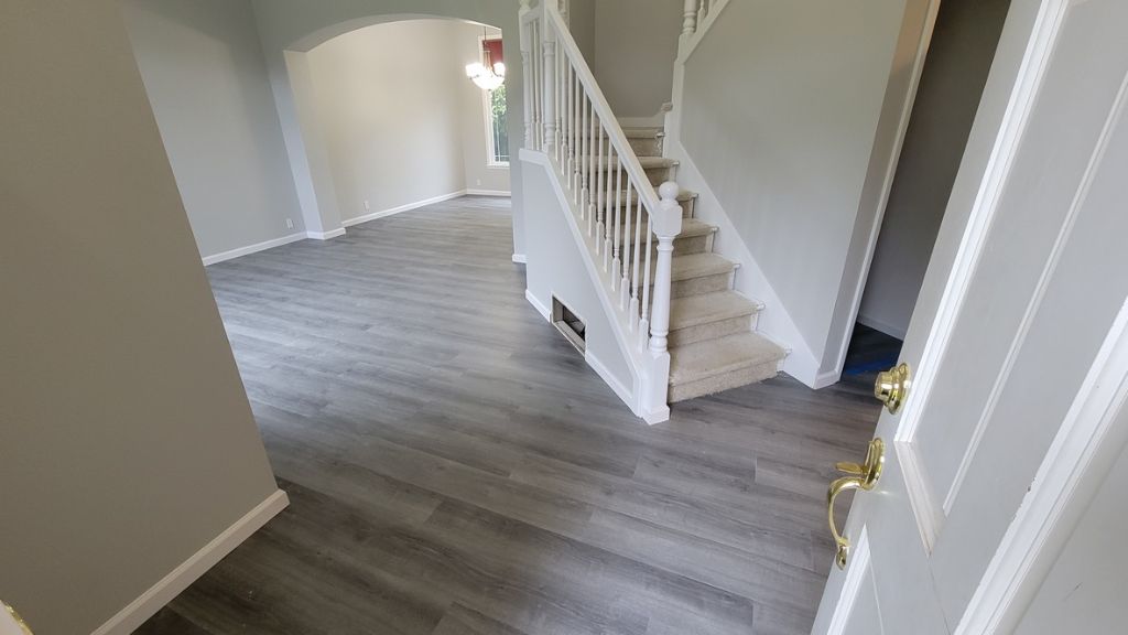 Foyer flooring installation — gray LVP